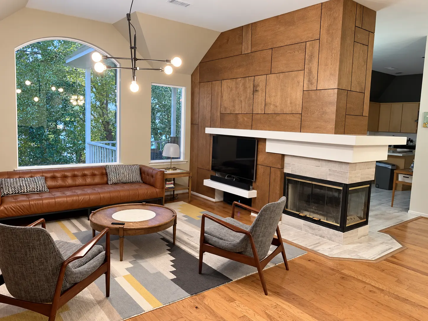 Living room with a custom wood feature wall